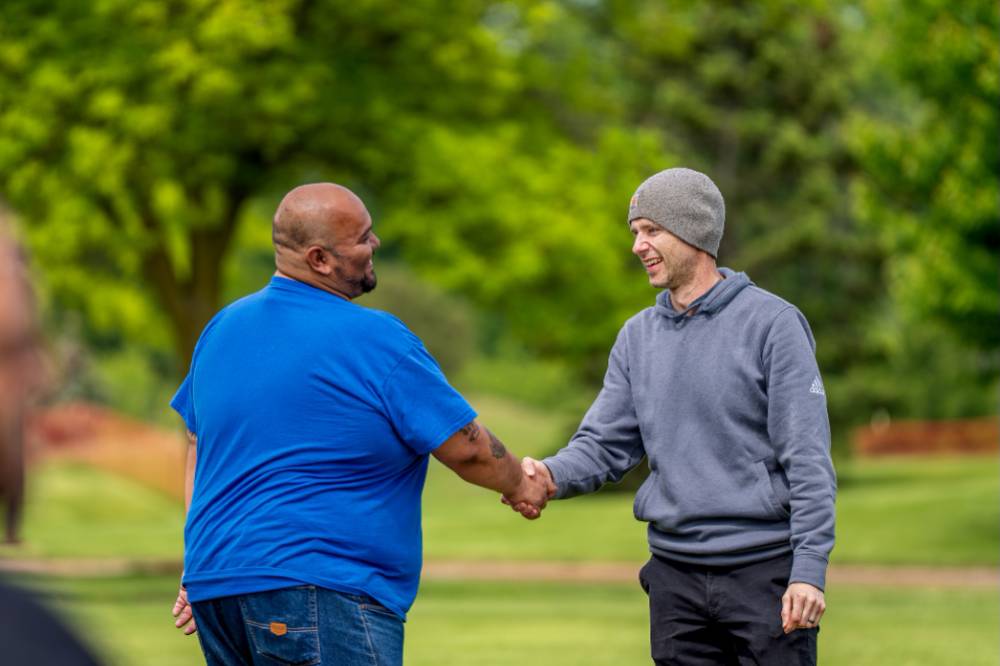 Two players shake hands after game
